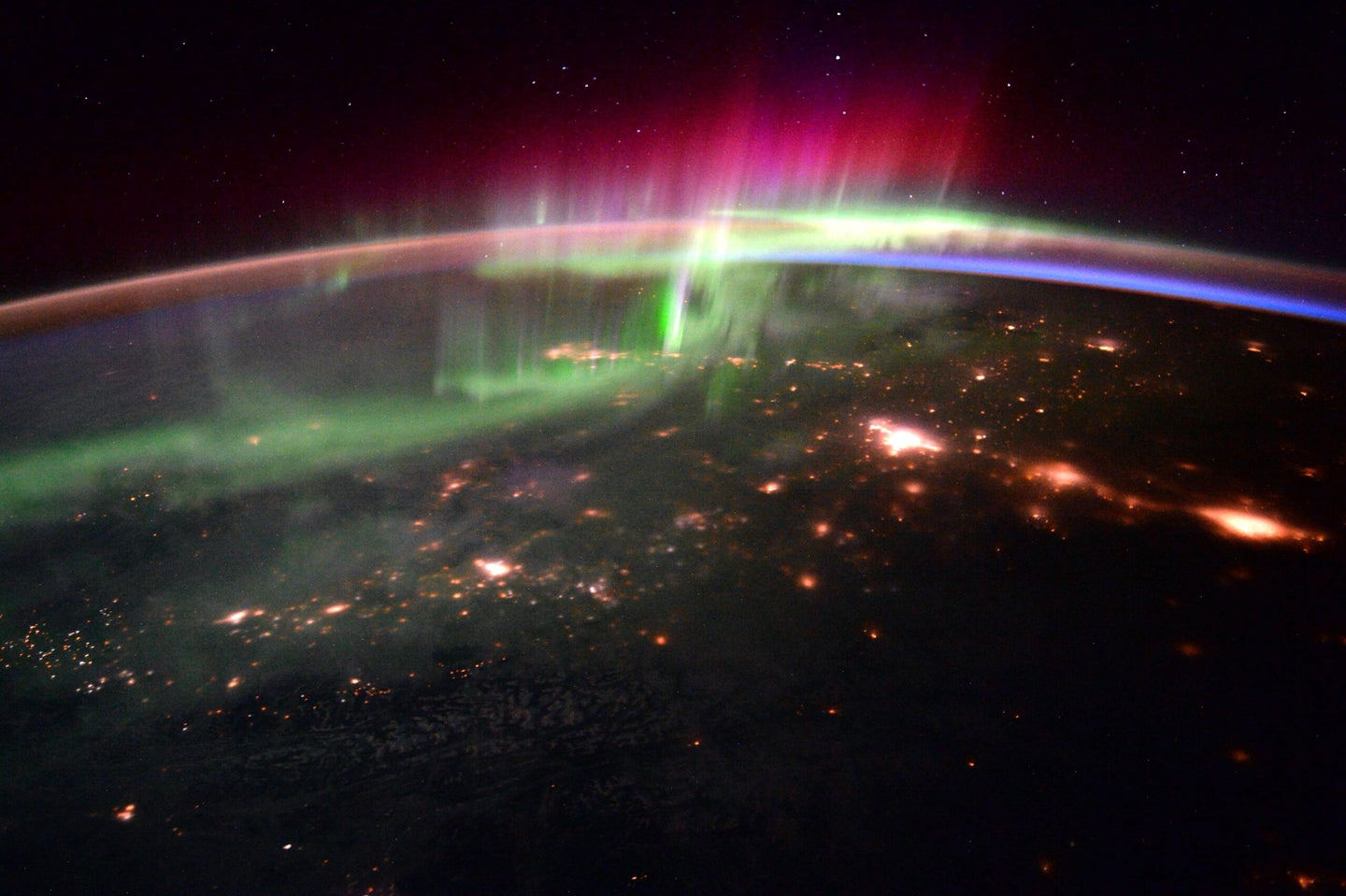 Auroras glow over the Pacific Northwest.