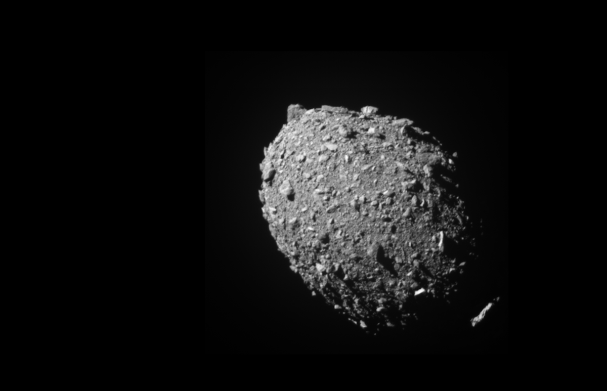 a black and white image of oval shaped asteroid