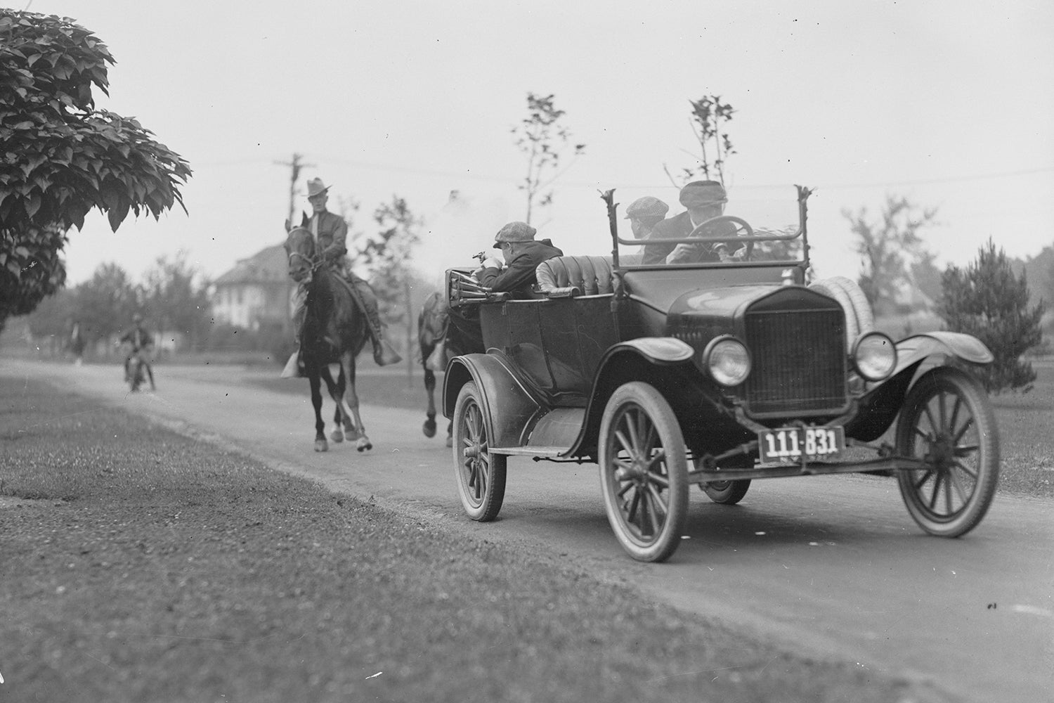 vintage photo of police on horse chasing car