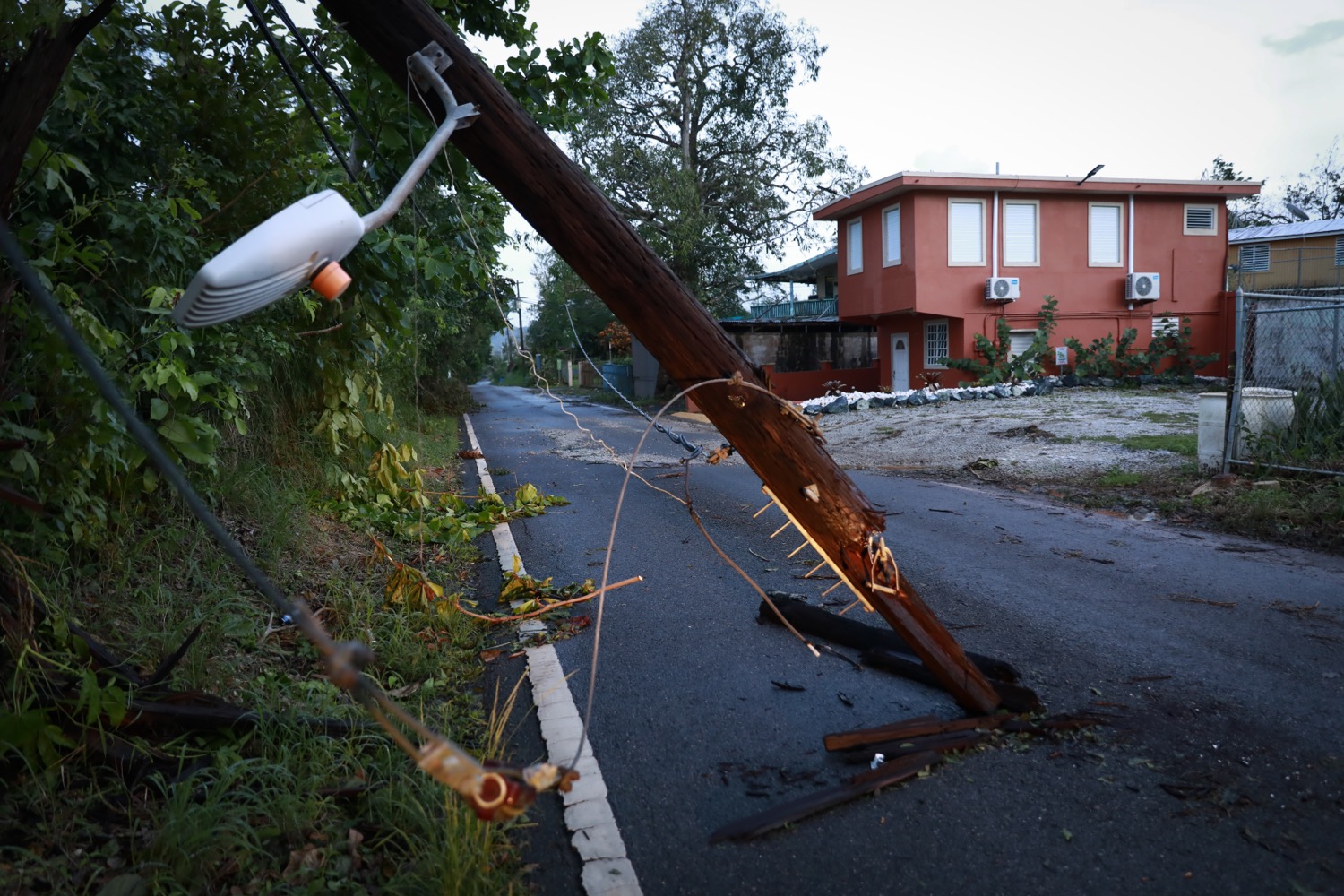 a downed electricity pole after a storm