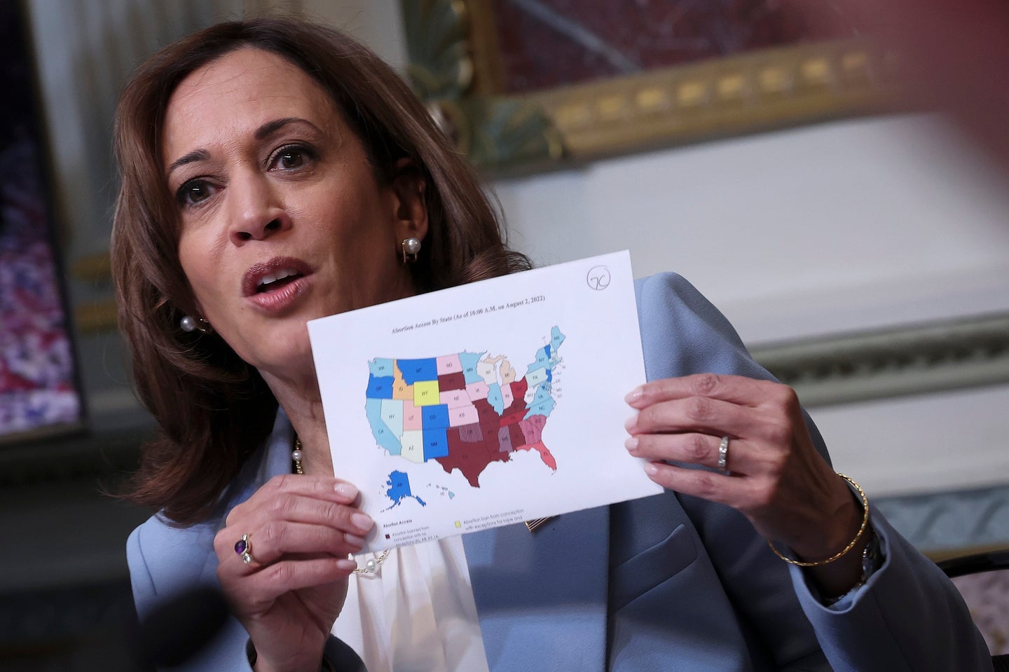 US Vice President Kamala Harris holds up a map of state abortion bans post-Roe v. Wade