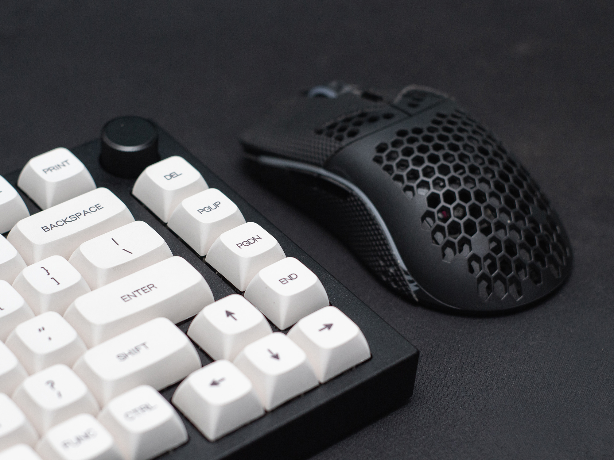 photo of a white keyboard and a black mouse