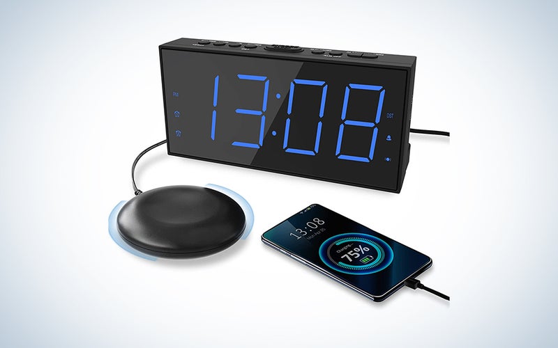 A black vibrating alarm clock with blue digital display lettering on a white and blue background