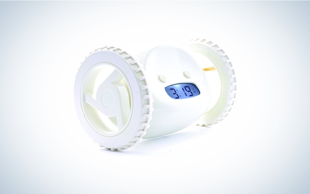 A white alarm clock with wheels on a blue and white background