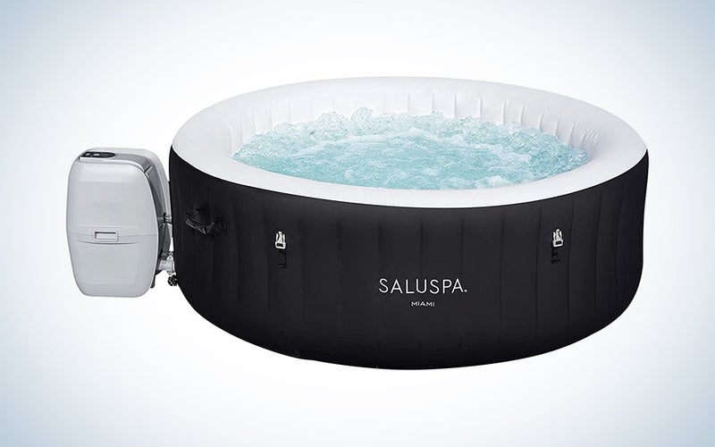 A black Bestway Saluspa inflatable hot tub on a blue and white background