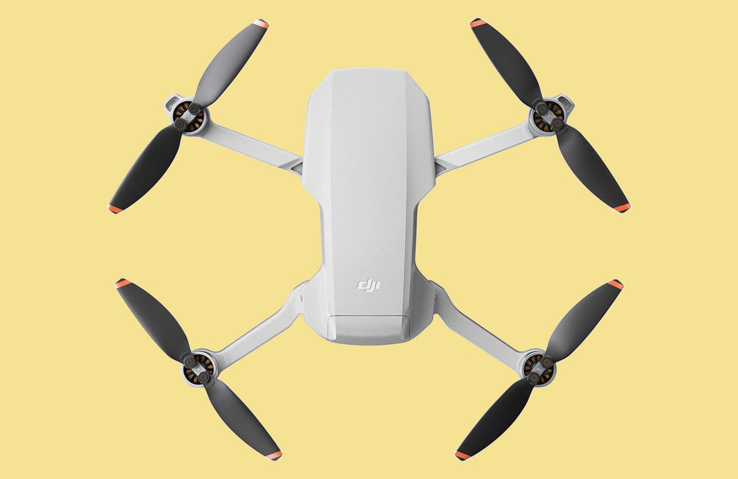 DJI Mini 2 drone from above on yellow