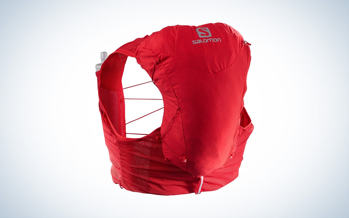 A red Saloman Adv Skin 12 Running Vest against a plain background.