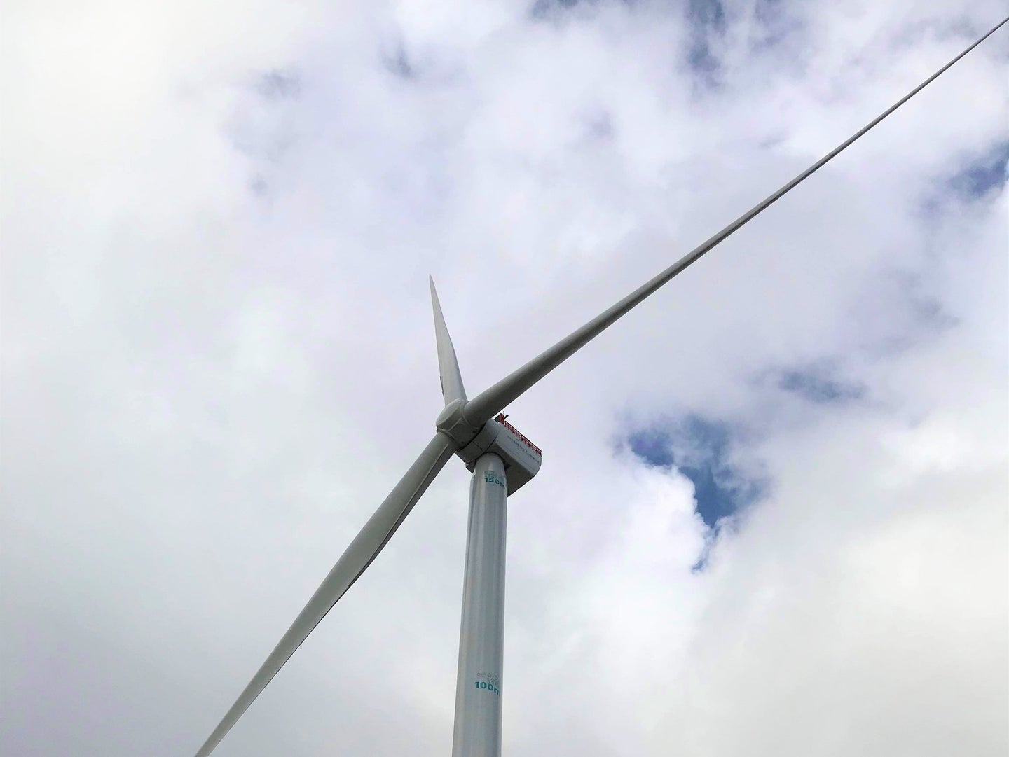 Siemens Gamesa wind turbine against blue sky backdrop