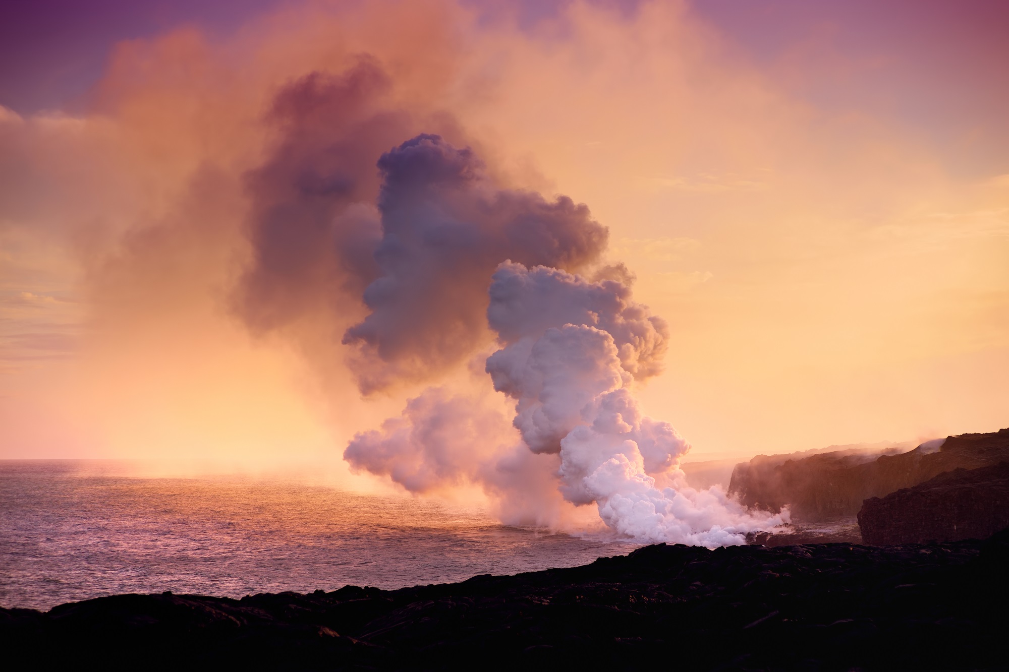 Volcano belching lava and gas above ocean to represent Great Oxygenation Event