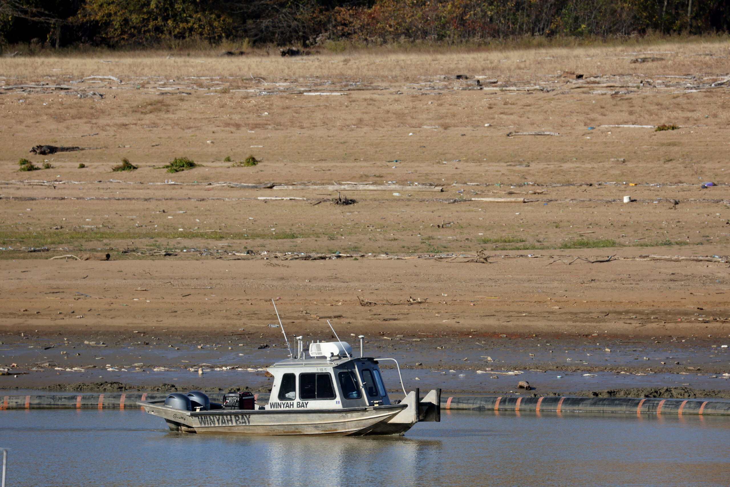 A boat navigates low water in McKellar Lake, a backwater of the Mississippi River on October 19, 2022.