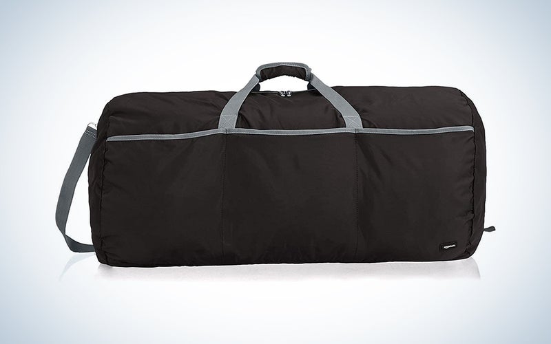 A black duffel from Amazon Basics on a blue and white background