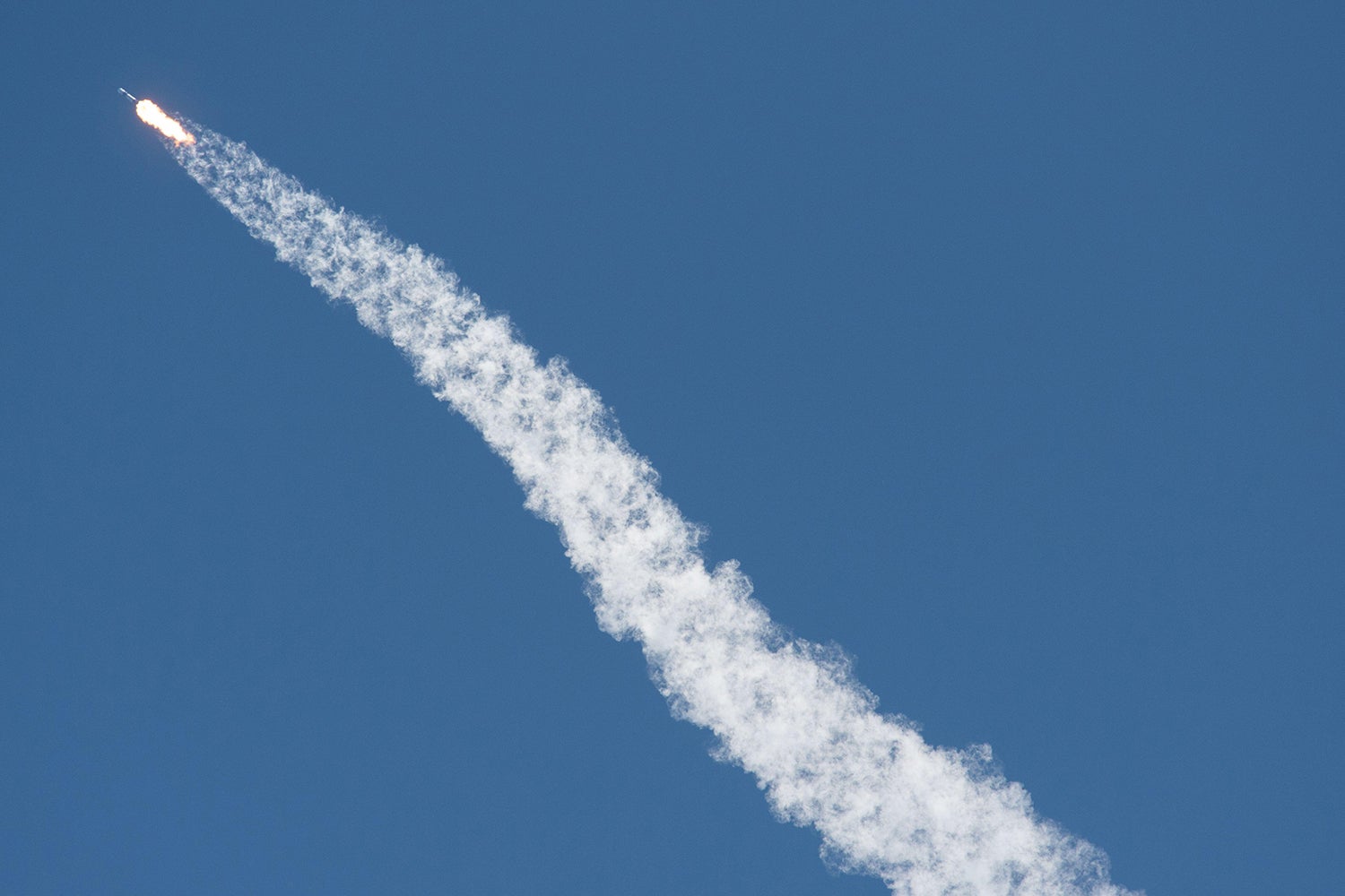 SpaceX Falcon rocket with smoky trail