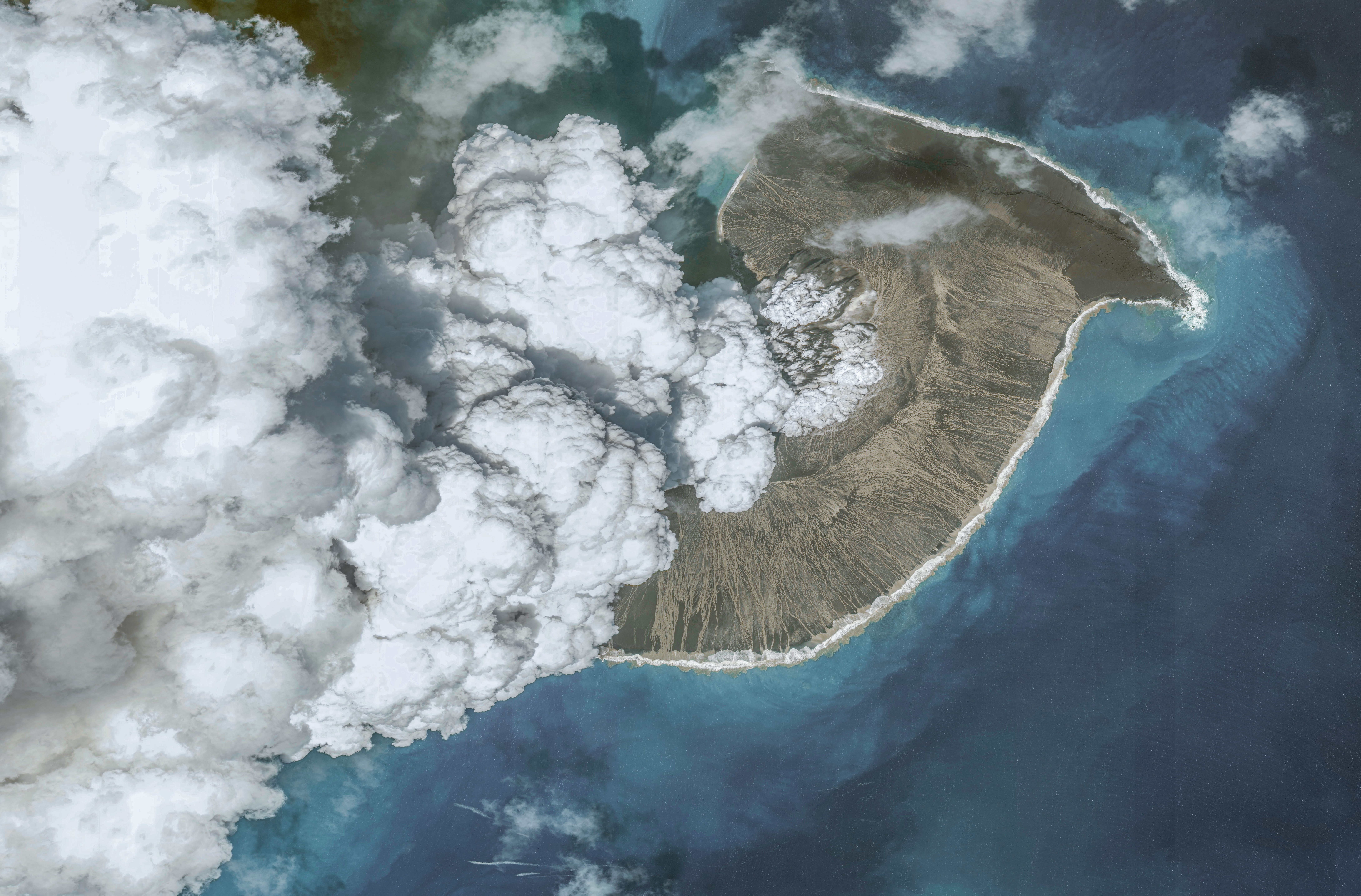 Tonga volcano eruption over land and water