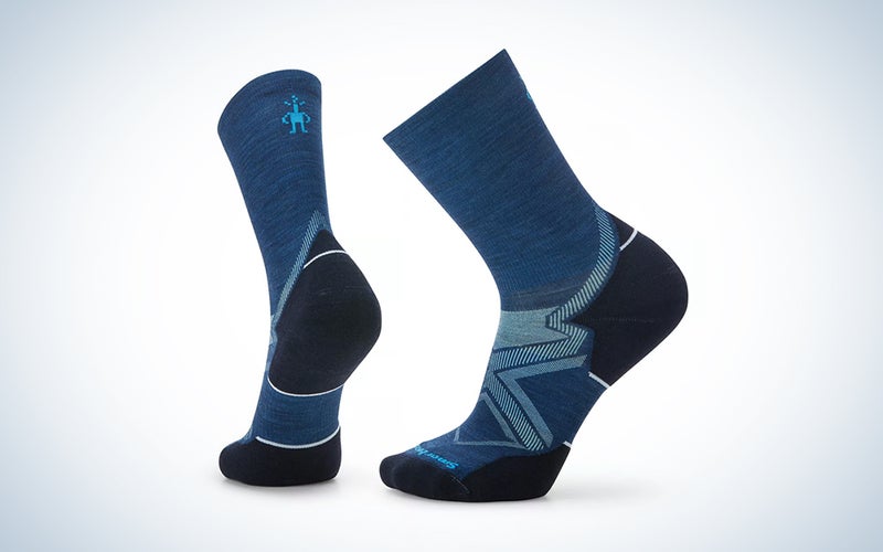 A pair of blue running socks on a blue and white background