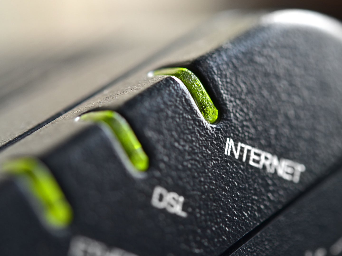 Closeup of black internet router showing Internet and DSL lights