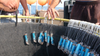 Photo of dozens of SharkGuard fishing repellent devices attached to hooks in storage aboard boat on the ocean