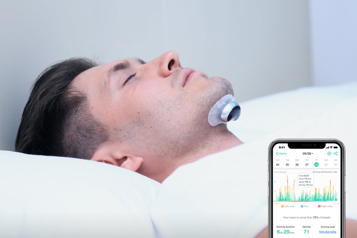 A person using a snoring device to stop snoring