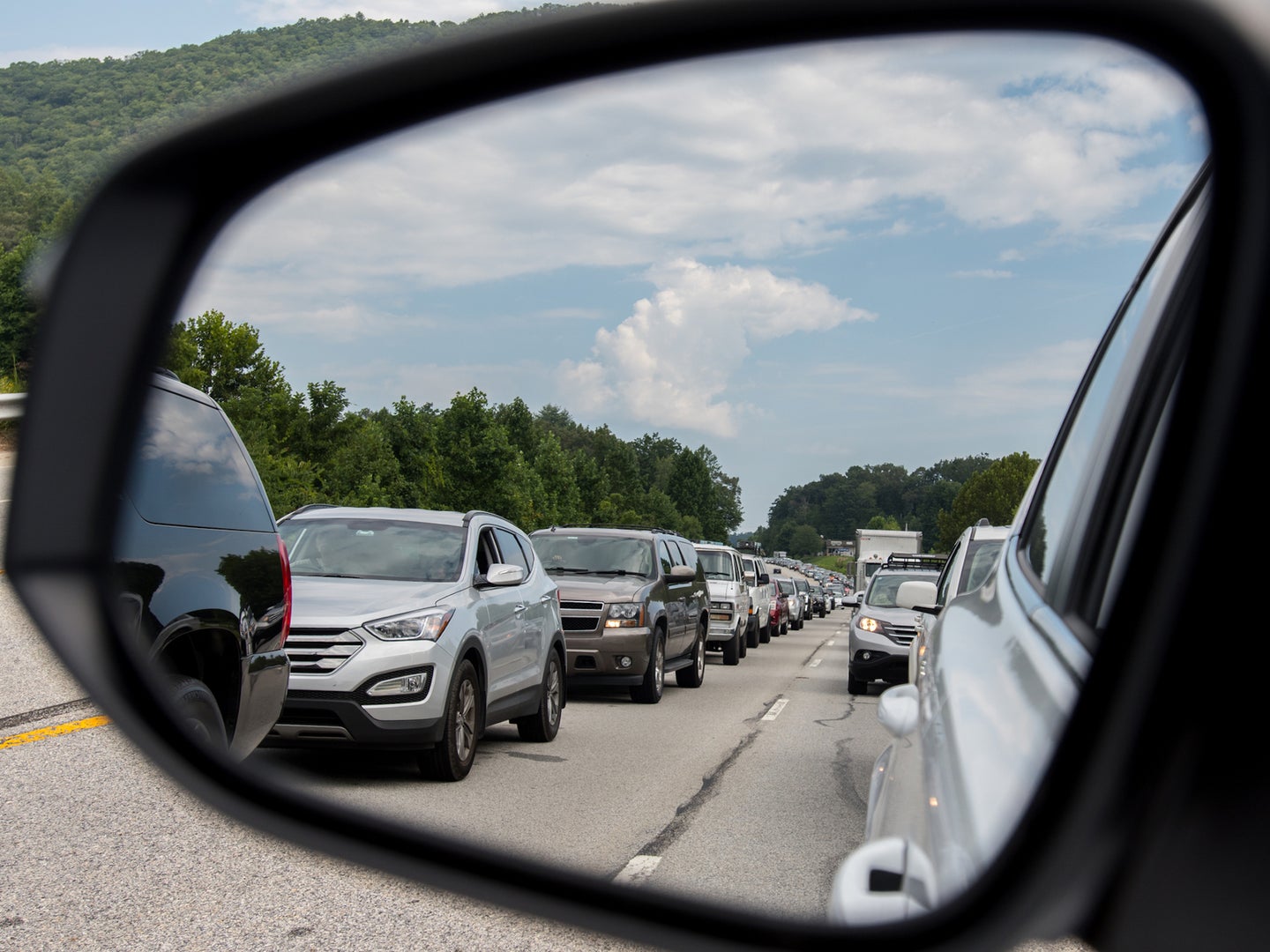 Traffic jam seen in car's sideview mirror