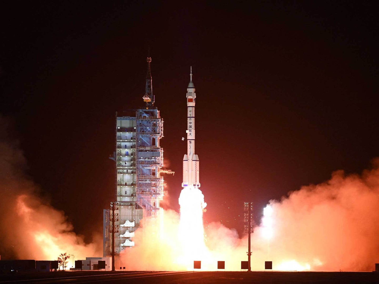 Chinese space rocket lifting off at night