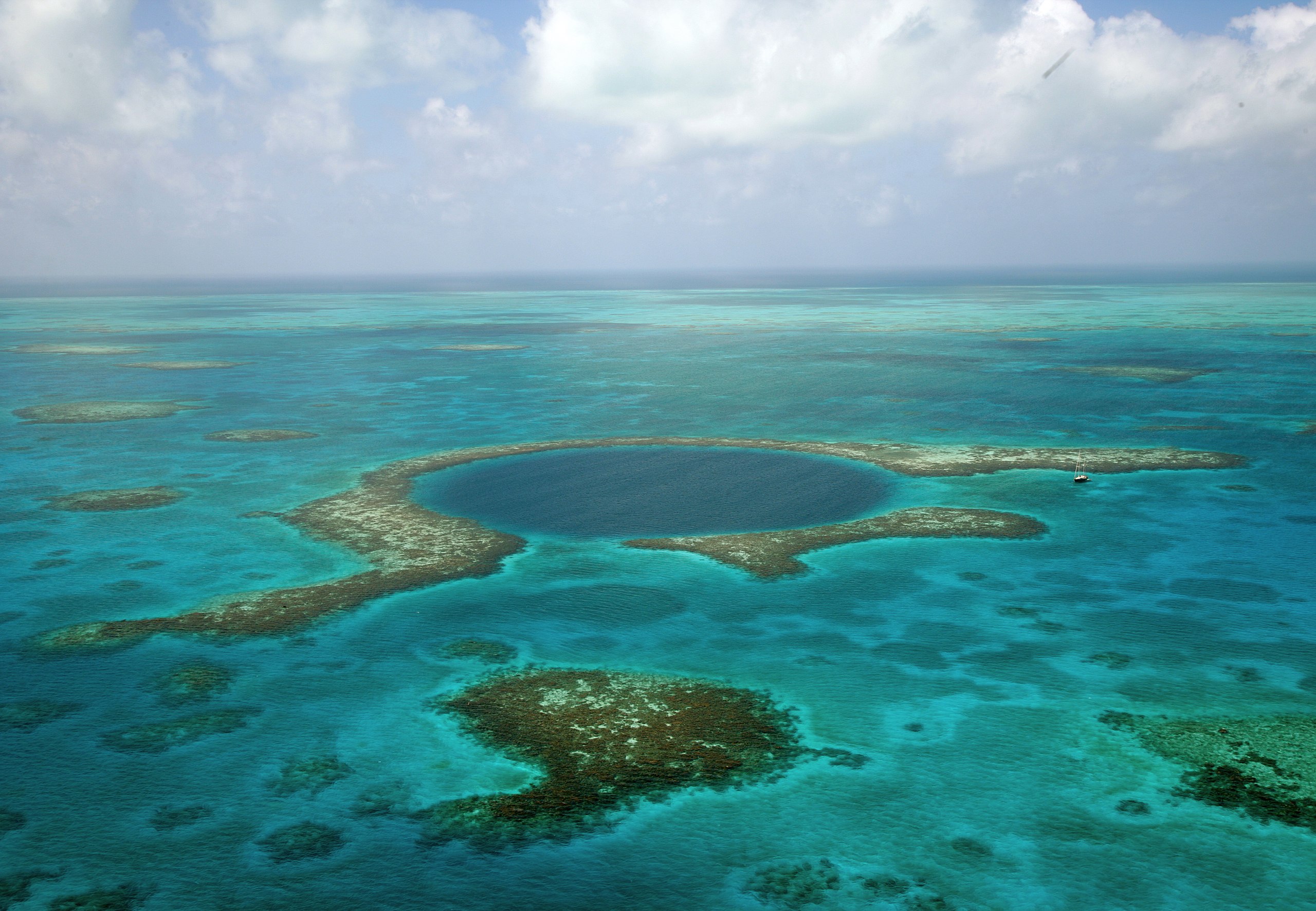 Deep ‘blue holes,’ like this one off Belize, can collect evidence of hurricanes. 