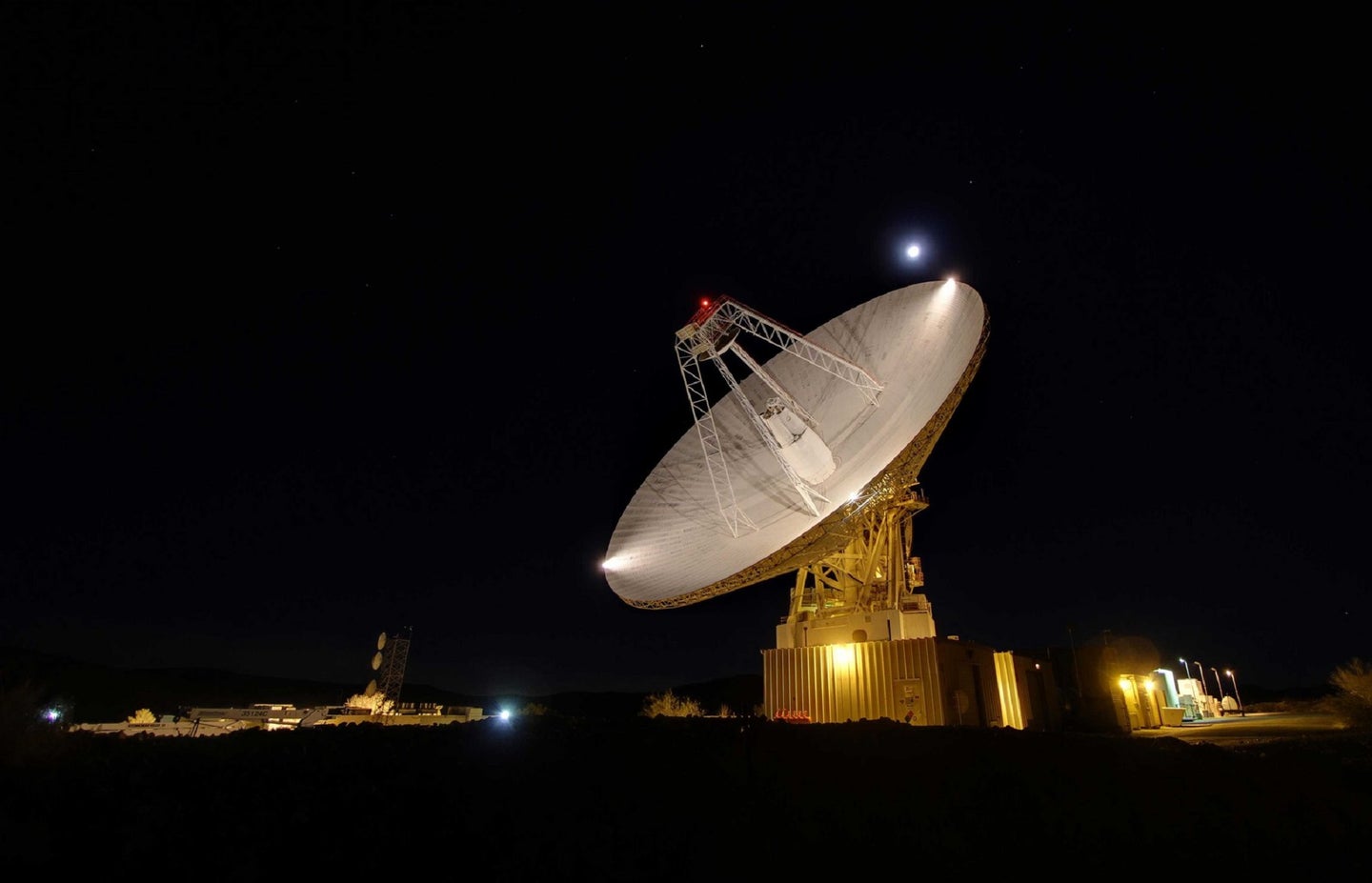 Deep Space Network giant NASA antenna at night