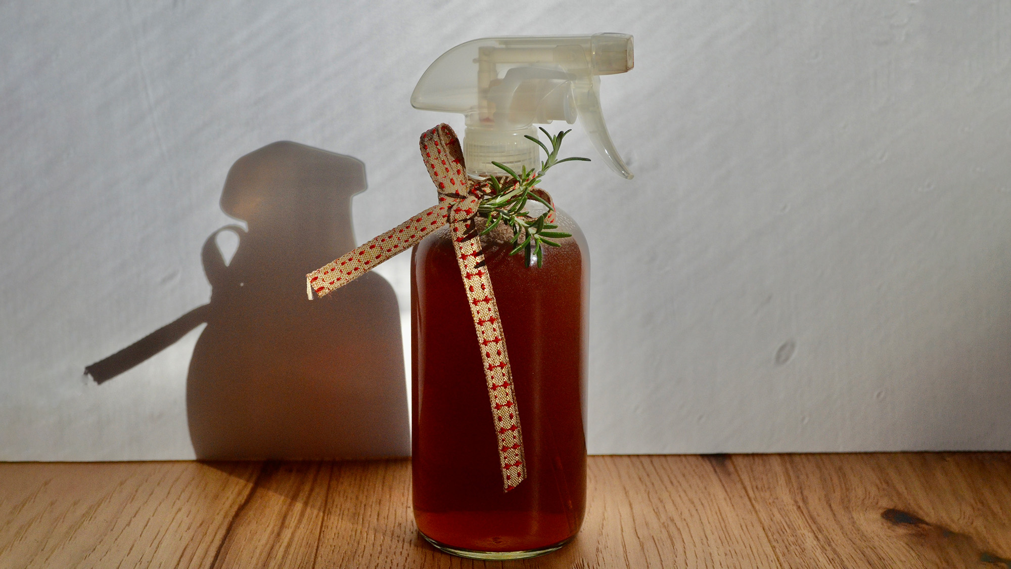 Spray-bottle-with-DIY-rosemary-water-for-hair