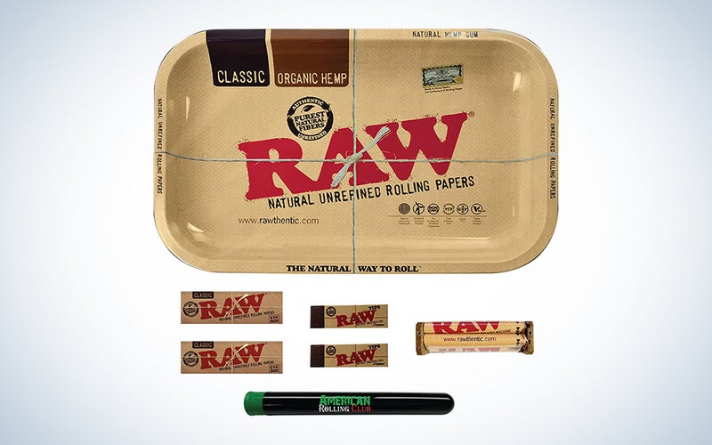 A RAW rolling tray with papers, a roller, and a joint holder