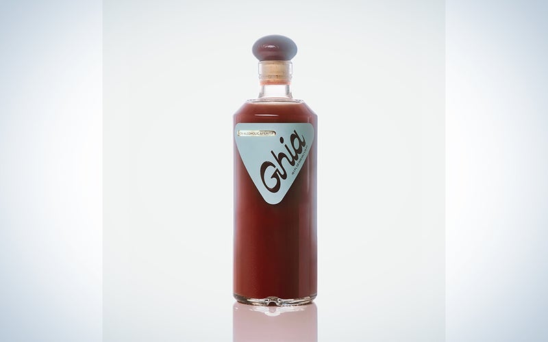 A bottle of Ghia on a blue and white background