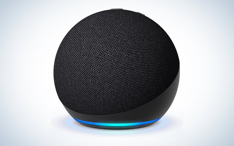 An Amazon Echo Dot on a blue and white background