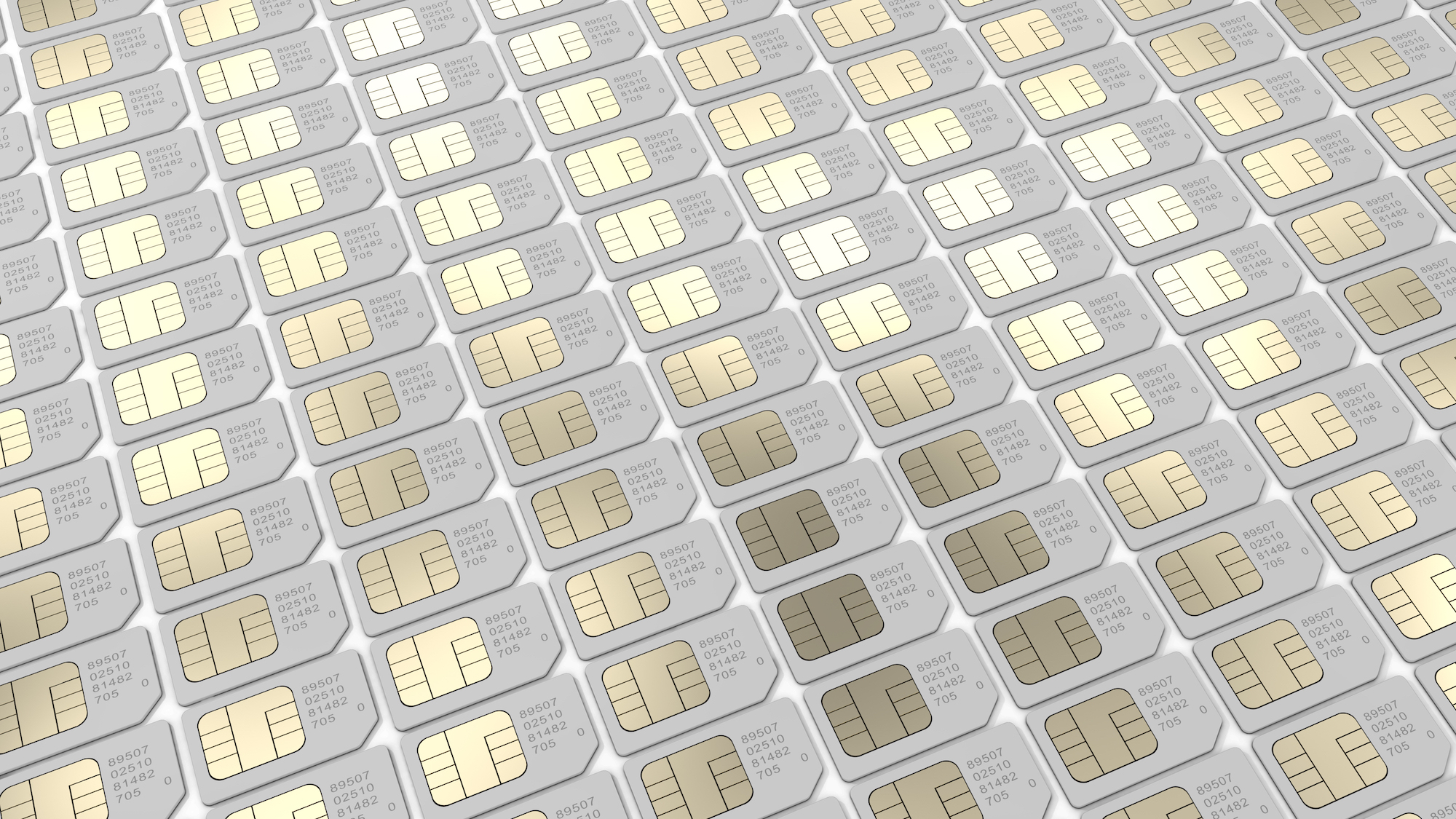 rows of white SIM cards showing their reflective shiny metal surface