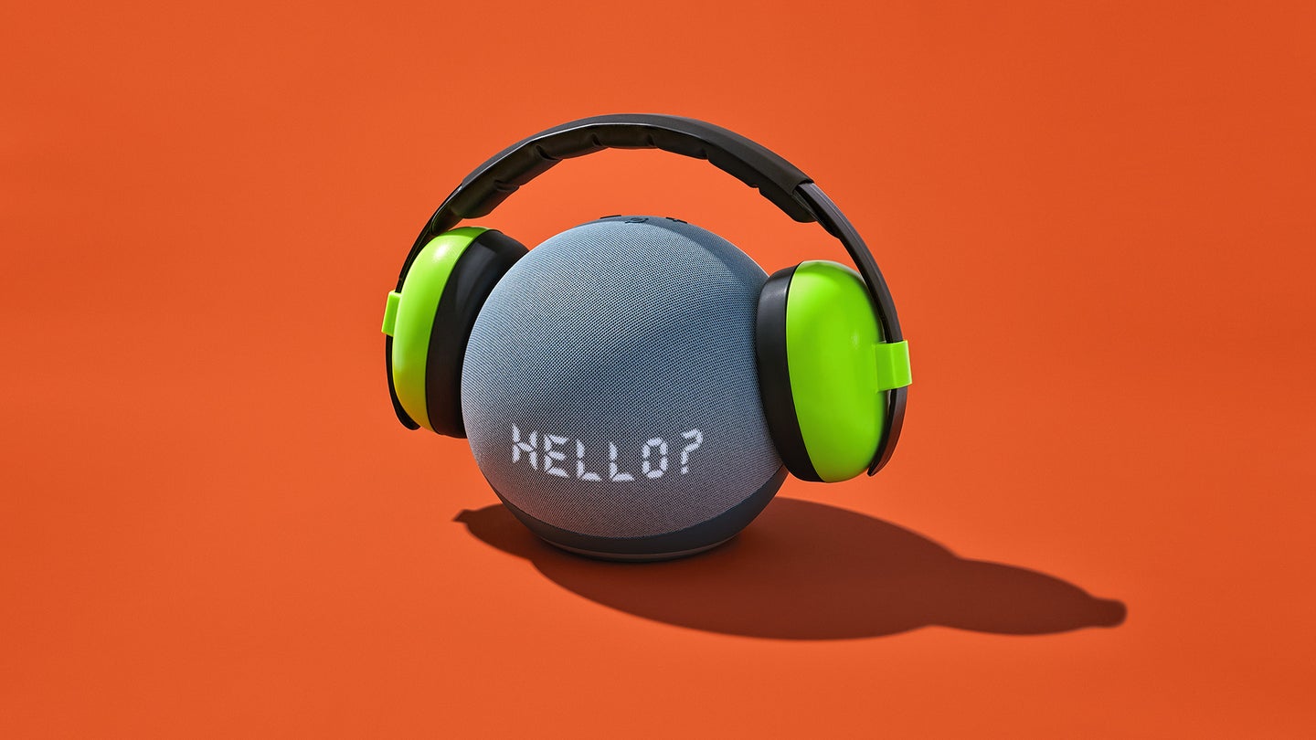 Amazon-echo-with-soundproof-earmuffs-with-word-hello-on-the-fronta-gainst-red-backdrop-