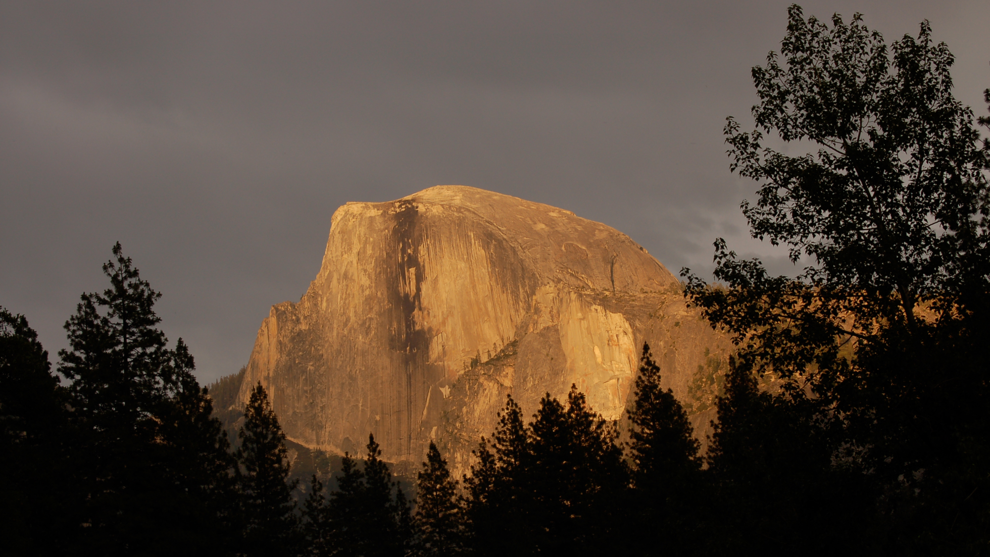 Half Dome in Yosemite National Park at sunset, where people have fallen to their deaths.