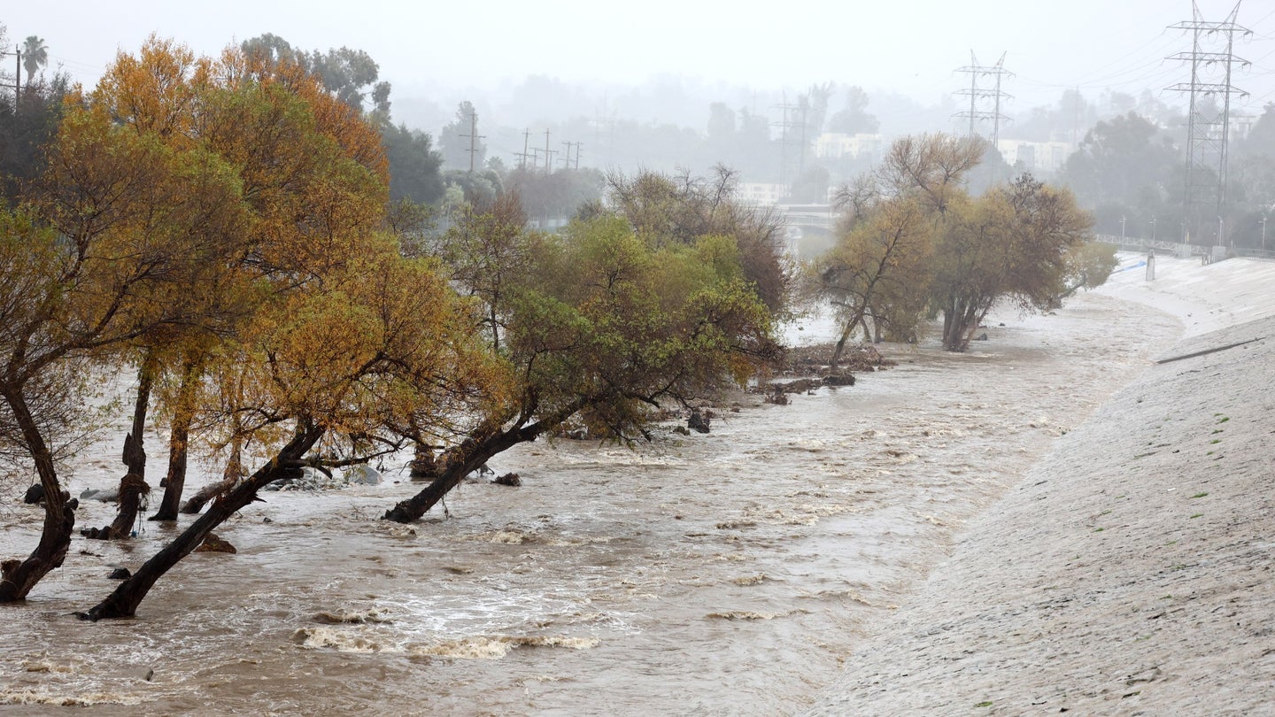 Rain falls as the Los Angeles River flows at a strong rate on January 09, 2023 in Los Angeles, California. 