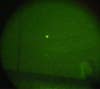 UAP seen in May, 2022, through night vision equipment and an SLR camera. The DOD states that "the UAP in this image were subsequently reclassified as unmanned aerial systems."