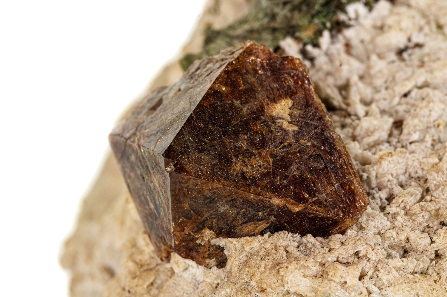 Brown Zircon mineral against white can be used to determine how old the Earth is