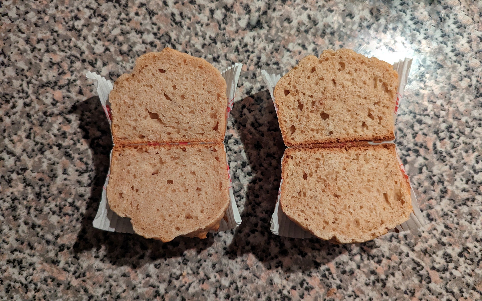 two muffins cut in half to show their inner texture