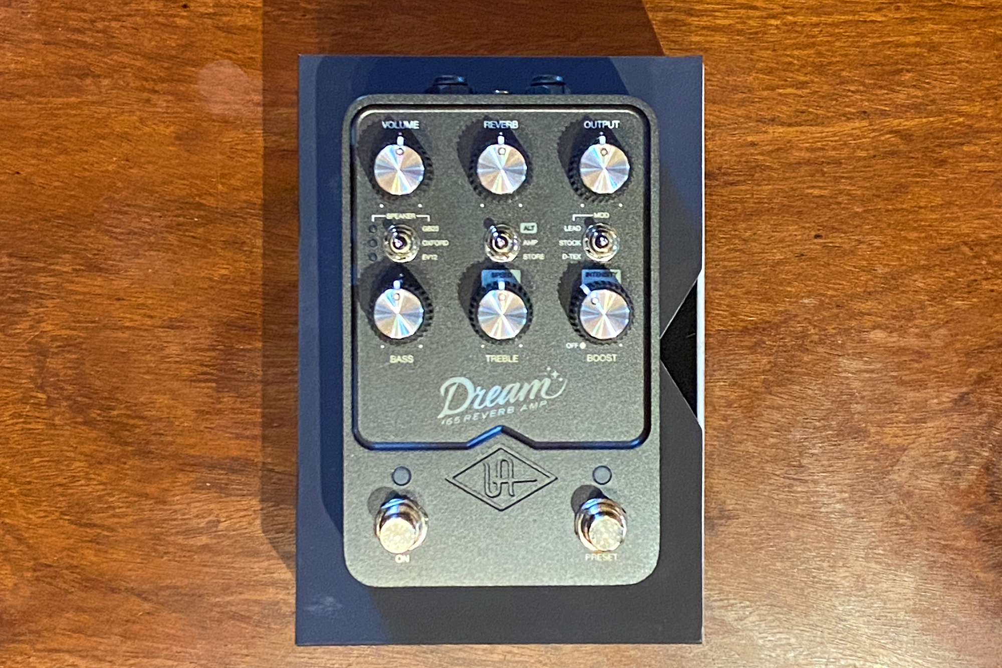 UAFX Dream guitar pedal sitting on top of its box