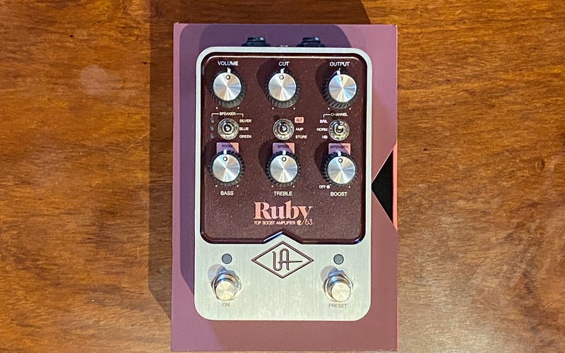 UAFX Ruby guitar pedal sitting on top of its box