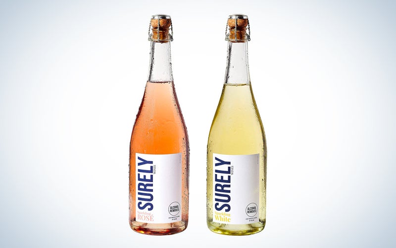 Two bottles of dealcoholized wine on a blue and white background