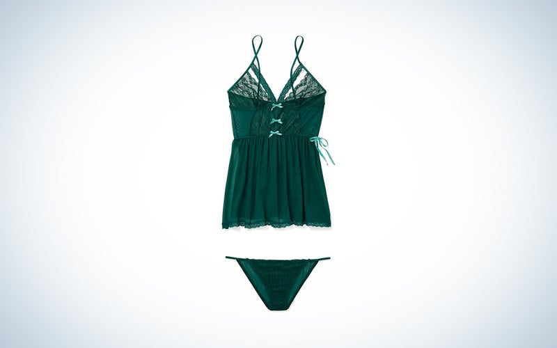 A green lace and mesh babydoll lingerie for women on a blue and white background.