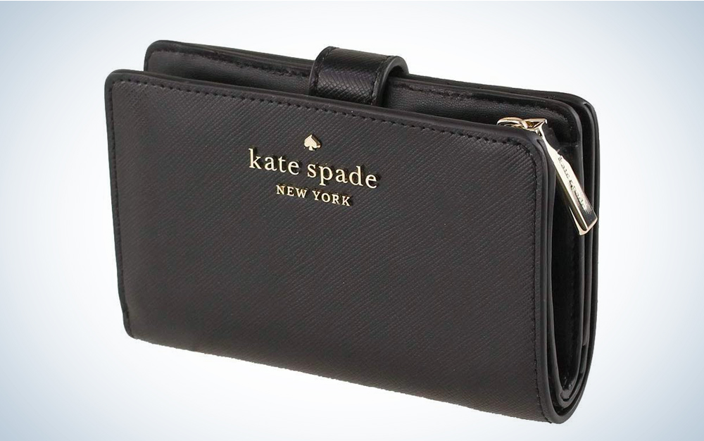 A black Kate Spade wallet on a blue and white background