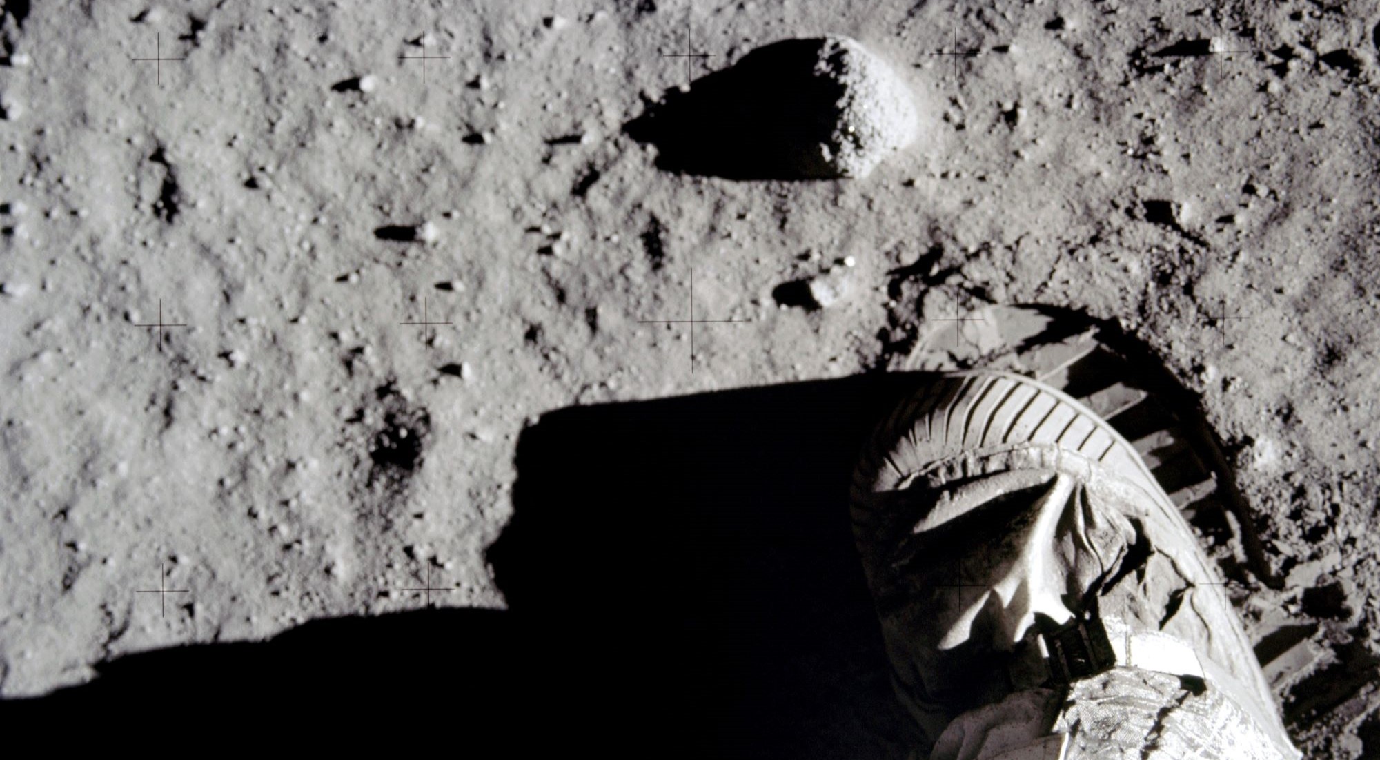 Apollo 11 commander Neil Armstrong leaves a boot print in dusty surface of the moon.