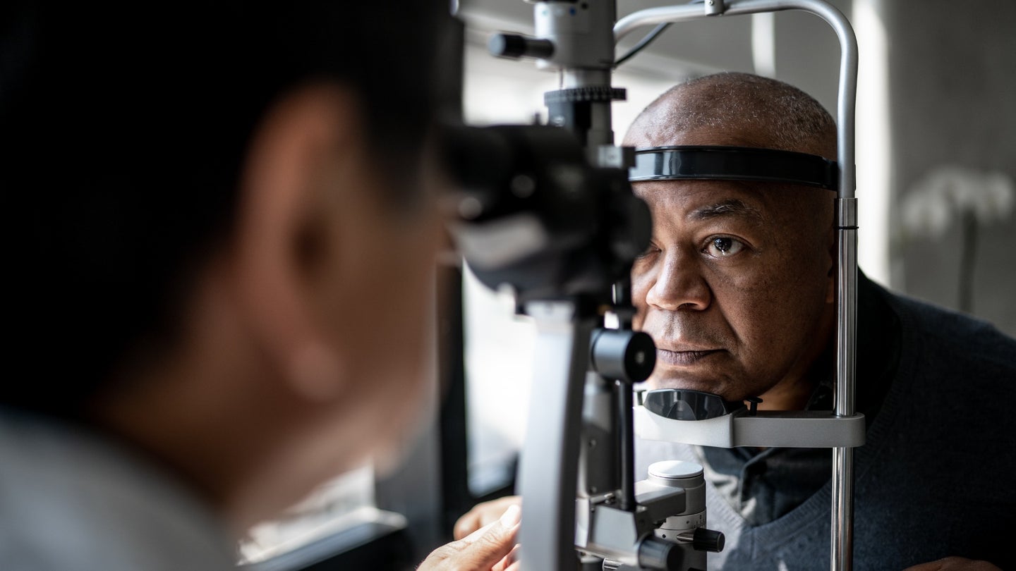 An ophthalmologist examines a patient’s eyes.