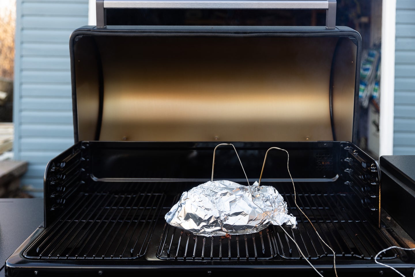 Traeger Ironwood XL grill review with a pulled pork smoking on it