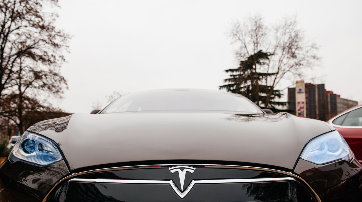Tesla Model S red electric car close-up of hood