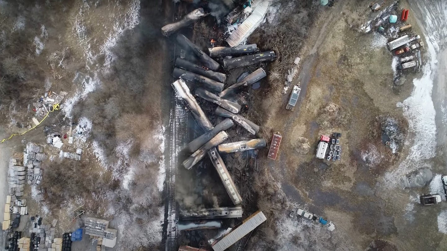 Trains derailed in Ohio burning on the tracks in a pile