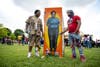 Guests stand near a painting of Breonna Taylor in her EMT uniform during a June 5, 2021 event in Louisville, Kentucky commemorated what would have been her 28th birthday. Taylor was a Black woman killed by police during a botched drug raid on her apartment on March 13, 2020.