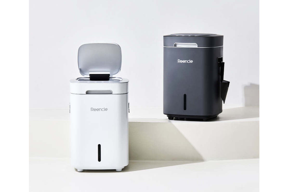 A black and white composter staged on a white backdrop.