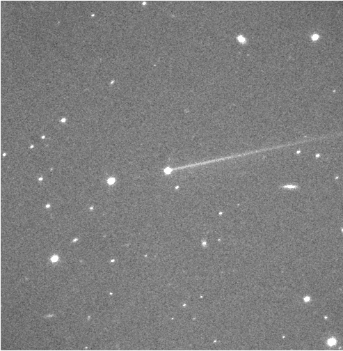 Dimorphos asteroid moving through night sky with tail after DART impact