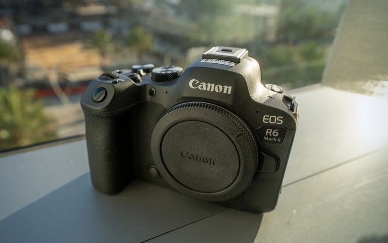 Canon EOS R6 Mark II sitting on a window sil.